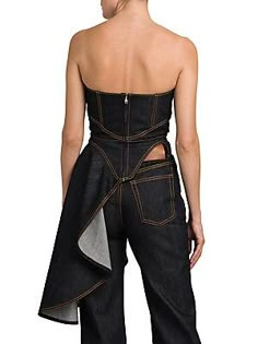 Cut in a cropped silhouette, Alexander McQueen's strapless denim corset top is finished with contrast topstitching and a draped asymmetric hem..Strapless.Sweetheart neck.Sleeveless.Open back.Back zip closure.Draped asymmetric hem.100% cotton.Dry clean.Made in Italy..SIZE & FIT..About 30" from topline to hem.Model measurements: 5'10" tall.Model is wearing a US size 4..ABOUT THE BRAND..Visionary designer Lee Alexander McQueen launched his brand in 1992, which quickly became synonymous with cutting Denim Draping, Asymmetrical Corset Top, Denim Tops Women, Luxury Fitted Denim Top, Denim Corset Street Style, Asymmetrical Corset, Trendy Denim Fitted Corset, Denim Editorial, Denim Top Women