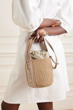 CHLOÉ Woody small leather-trimmed raffia basket bag Rattan Basket Bag, Chloe Woody Basket Bag Outfit, Chloe Vibes, Riviera Chic, Raffia Basket, Trendy Purses, Birthday Inspo, Bike Basket, Drawstring Top