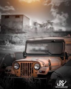 an old jeep parked in front of a building with the sun shining down on it