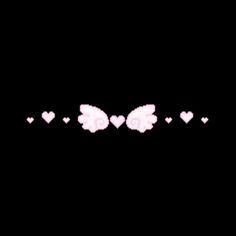 an image of hearts and wings in the dark