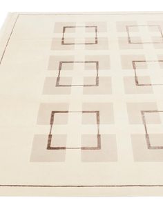 an area rug with squares and rectangles on it