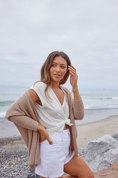 Details You can layer any basic piece with this super soft rib knit cardigan! Features include a drop shoulder, rib knit fabrication, and an open front. Style it over an essential neutral piece such as a cami, tank, or crop top and then pair it with white shorts and open toed sandals for a cute summer look. Lightweight & soft Dolman sleeve Drop shoulder Open front Rib knit Front ends lay open 100% Acrylic Color: Dark Beige Colors may vary on different viewing devices Size and fit Fits true to si Chic Ribbed Cardigan For Day Out, Trendy Open Front Knit Top, Open Front Knit Tops For Day Out, Versatile Open Front Tops For Day Out, Spring Ribbed Cardigan For Day Out, Chic Open Front Tops For Layering, Neutral V-neck Cardigan For Layering, Versatile V-neck Cardigan For Day Out, Rib Knit Cardigan