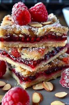 raspberry almond bars stacked on top of each other