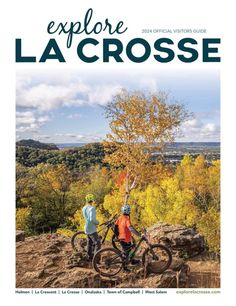 two people standing on top of a mountain next to a tree with the words explore la crosse