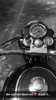 the handlebars and gauges on a motorcycle are shown in black and white