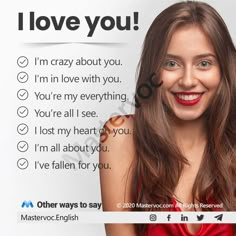 a woman with long brown hair wearing a red dress and smiling at the camera, in front of a sign that says i love you