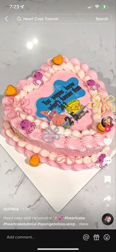 a pink spongebob birthday cake on top of a white table with the words happy birthday