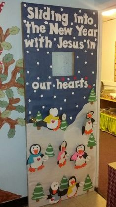 a door decorated with penguins and snowflakes for the new year's eve