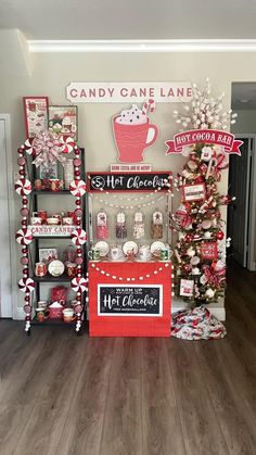 the candy cane lane display is decorated with red and white candies, hot chocolates, marshmallows