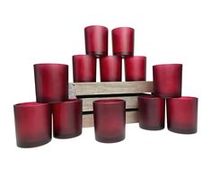 a bunch of red candles sitting next to each other