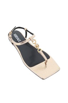 Versace thong sandals made of snake-effect laminated leather with gold metal Medusa detail embellished with crystals. Adjustable ankle strap, leather footbed and leather sole. Versace Gold, Versace Brand, Sneaker Wedge, Gianni Versace, Italian Luxury, Thong Sandals, Bridal Shoes, Manolo Blahnik, Luxury Boutique