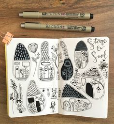 an open notebook with drawings on it