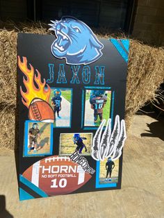 a sign with pictures of football players on it and the name of each team is displayed in front of hay bales