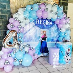 a frozen princess birthday party with balloons and decorations