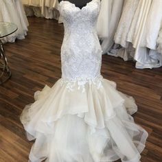 a wedding dress on display in a store