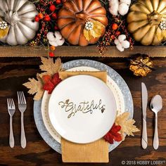 the instagram page on instagram shows an autumn table setting with white plates and silverware