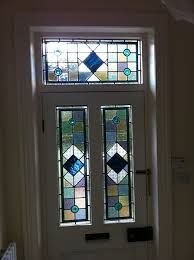 a white door with two stained glass windows