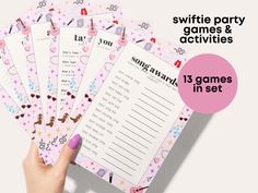 a person holding five game cards in front of the text, write party games & activities 13 games in set