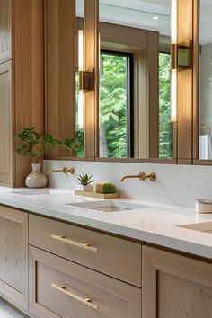 a bathroom with double sinks and wooden cabinets