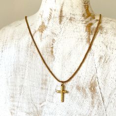 Lovely Avon chain with a vintage detailed cross.  Details:  * Era: 1960s-1980s * Mark/Signature: Avon on Chain * Hangs to: below collar bone. Princess length * Metal: Gold Tone * Clasp: Spring * Christian Size: Unisex One Size Measurements: Chain Length 18 in Cross Height 0.75 in Cross Width 0.375 in Dimensions approximate. Very good vintage condition.  Vintage jewelry arrives nicely packaged for gifting or storing. Find more sparkly goodness at hellosparkly.com. Avon Cross Necklace, Detailed Cross, Cross Christian, Collar Bone, Santa Fe Nm, Delicate Chain, Chain Lengths, Chains Necklace, Vintage Jewelry