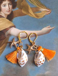 Unique baroque earring shell and orange tassels Real shell and gold metal star Total length: 7 cm Sent in a bubble envelope in letter followed, with an organza gift pouch. Thank you for your visit Beach Gold Tassel Earrings, Gold Dangle Tassel Earrings For The Beach, Gold Tassel Earrings For Beach, Elegant Gold Tassel Earrings For Beach, Gold Tassel Earrings For Beach Summer, Gold Tassel Earrings For Beach In Summer, Orange Tassel Earrings Gift, Orange Beaded Tassel Earrings As Gift, Elegant Orange Tassel Earrings For Gift