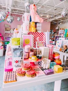 there are many items on the table in this room and one is pink, yellow, orange, and white