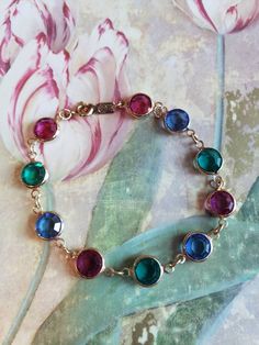 This is a vintage Swarovski blue, hot pink and teal crystal bracelet. The crystals are round and faceted. The Swarovski swan tag is also on this piece. A few of the crystals have some faint scratches. The price reflects this. All sales are final. This piece will come to you with insurance. This measures: 7.25 inches long. Don't forget to stop in at my other Etsy shop... http://www.etsy.com/shop/xtdesigns. Follow me on Twitter at... MyYiayiaHadThat@MyYiayiaHadThat. If you have a wish list or are Jeweled Round Crystal Bracelet As Gift, Jeweled Round Crystal Bracelet For Gift, Jeweled Crystal Bracelet Gift, Hot Pink And Teal, Teal Swan, Swarovski Swan, Crystal Bracelet, Chain Link Bracelet, Crystal Bracelets