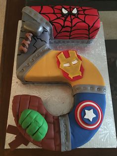 a birthday cake made to look like the avengerss