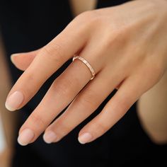 This 14k solid gold ring features stunning baguette-cut lab-created diamond simulants that sparkle with every movement. Its minimalist design makes it perfect for daily wear, whether you're dressing up or keeping it casual. The dainty band is both elegant and timeless, adding just the right amount of shine to your look. Crafted with care from high-quality materials, this ring is made to last for years. It's an excellent choice for a special gift or a treat for yourself. Ring Details * Gold KT: 14k Solid Gold (also available in 18K) * Gold Color Options: White, Yellow, Rose Gold * Gemstone: AAA Grade White Cubic Zirconia * Ready to Ship 3-10 Business Days Minimalist Gold Ring, Dainty Band, Baguette Ring, Diamond Simulant, Baguette Cut, Eternity Band, Lab Created Diamonds, Jewelry For Women, Eternity Bands