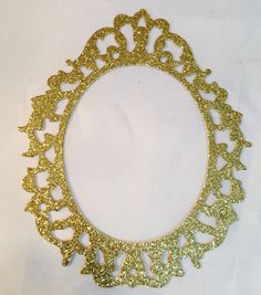 a gold glittered circular frame on a white background