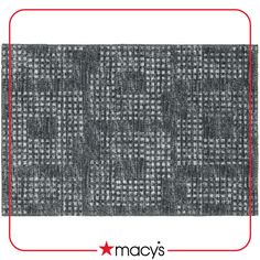 the back side of a gray rug with red trimmings and a white background