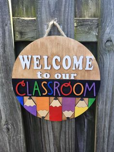 a wooden sign that says welcome to our classroom