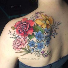 a woman's back with flowers on it