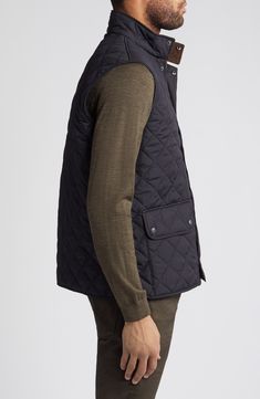 This sleek, diamond-quilted vest detailed with oversized flap pockets is a layering essential for the season and offers warmth, versatility and style. 27 1/2" length (size Medium) Front snap closure Stand collar Front snap-flap patch pockets Lined, with polyester fill 100% polyester Machine wash, line dry Imported Diamond Quilted Outerwear For Work In Fall, Diamond Quilted Outerwear For Fall Workwear, Diamond-quilted Outerwear For Fall Workwear, Fall Workwear Outerwear With Diamond Quilting, Quilted Casual Vest For Work, Casual Quilted Vest For Work, Quilted Sleeveless Vest For Workwear, Quilted Sleeveless Workwear Vest, Winter Diamond Quilted Outerwear For Work