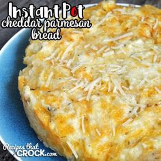 a blue plate topped with cheesy bread and cheese