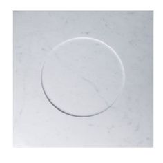 a white marble counter top with a circular design