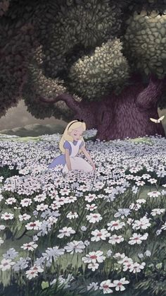 a woman sitting in the middle of a field full of white daisies and trees