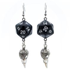 For Raven Queen worshippers who don't want to wear our huge and heavy (but very cool) raven earrings, we also offer this smaller, lighter (but still very cool) version. Each has a pearl black D20. Beneath the dice hang silvery raven skull charms. These would be a perfect accessory for someone playing a member of the shadar-kai or a cleric that worships the Raven Queen. A great gift for players of D&D, Pathfinder, and other tabletop RPGs -- or for anyone who wants to geek out with a fun and myste Black Fantasy Style Earrings, Black Fantasy Earrings, Black Fantasy Style Pierced Earrings, Black Skull Earrings For Gift, Adjustable Black Skull Earrings, Adjustable Black Skull-shaped Earrings, Black Fantasy Dangle Jewelry, Nickel Free Black Skull Earrings, Black Novelty Drop Earrings