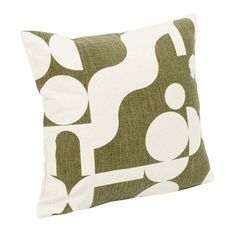 a green and white pillow with circles on it