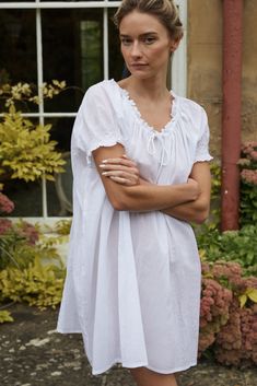 A family business, If Only If is obsessed with the classic nightgown from its timeless silhouette to the most special details. Crafted in 100% natural materials, these nightdresses are romantic, practical, and become even softer with every wash. Crafted from soft cotton, the Clover Smocked Cotton Voile Nightdress is made specially for those sultry summer nights. Featuring an adjustable drawstring neckline, and hand-smocked cap sleeves, it's a warm weather dream come true. Product Details 100% GO Linen Nightgown, Cotton Night Dress, Cotton Nighties, White Nightgown, Drawstring Neckline, Cotton Nightgown, Farm Girl, Capped Sleeve Dress, If Only