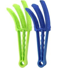 three plastic toothbrushes with blue and green handles