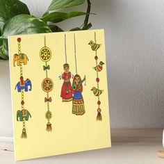 an artistic painting on yellow paper with elephants and people hanging from it art board print