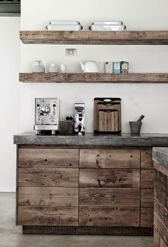 an image of a kitchen with wooden shelves and counter tops on the bottom right side