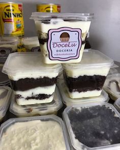 several plastic containers filled with ice cream and cake