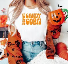 Add some fun to your spooky season with this Cute Halloween T-shirt! Perfect for candy corn lovers and anyone who enjoys the playful side of Halloween, this shirt makes a funny gift that's great for the season. With a cozy, oversized fit, it's ideal for staying comfortable while celebrating Halloween in style. Whether you're attending a party or just looking for a fun, festive shirt, this tee is the perfect way to enjoy spooky season with a smile. 🟡 Most customers find our shirts fit true to si Candy Corn Shirt, Corn Shirt, Festival Shirts, Halloween T Shirt, T Shirt Oversized, Look Plus, Candy Corn, Halloween Tshirts, Cute Halloween