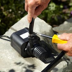 a man is using a small electric device