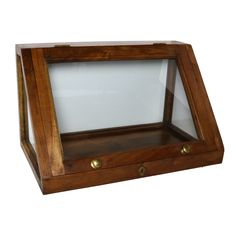 an empty wooden box with glass in it