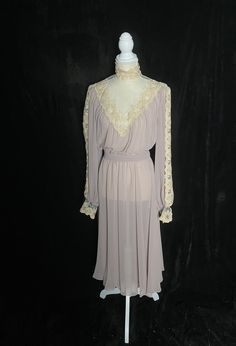 "1980's sheer purple long sleeve bridesmaid dress with cream lace collar and sleeve details. Covered buttons up half of the back. Matching belt Great vintage condition Women's small (meant to be oversized) Bonnie Strauss 48\" or smaller bust 26-30\"waist free hips 19\" shoulder to waist 31\" waist to hem" Feminine Long Sleeve Dress With Lace Bodice, Purple Sheer Long Sleeve Dress, Purple Long Sleeve Sheer Dress, Vintage Fitted Dress With Sheer Sleeves, Vintage Long Sleeve Dress With Lace Trim For Party, Sheer Fitted Vintage Dress For Wedding, Fitted Sheer Vintage Dress For Wedding, Spring Dresses With Lace Collar For Vintage Events, Long Sleeve Lace Vintage Dress