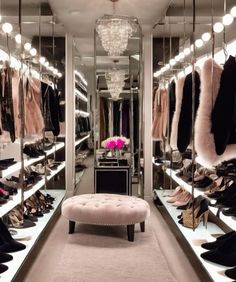 a walk in closet filled with lots of shoes