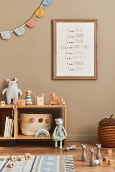 there is a toy shelf in the room with toys on it and a stuffed animal next to it